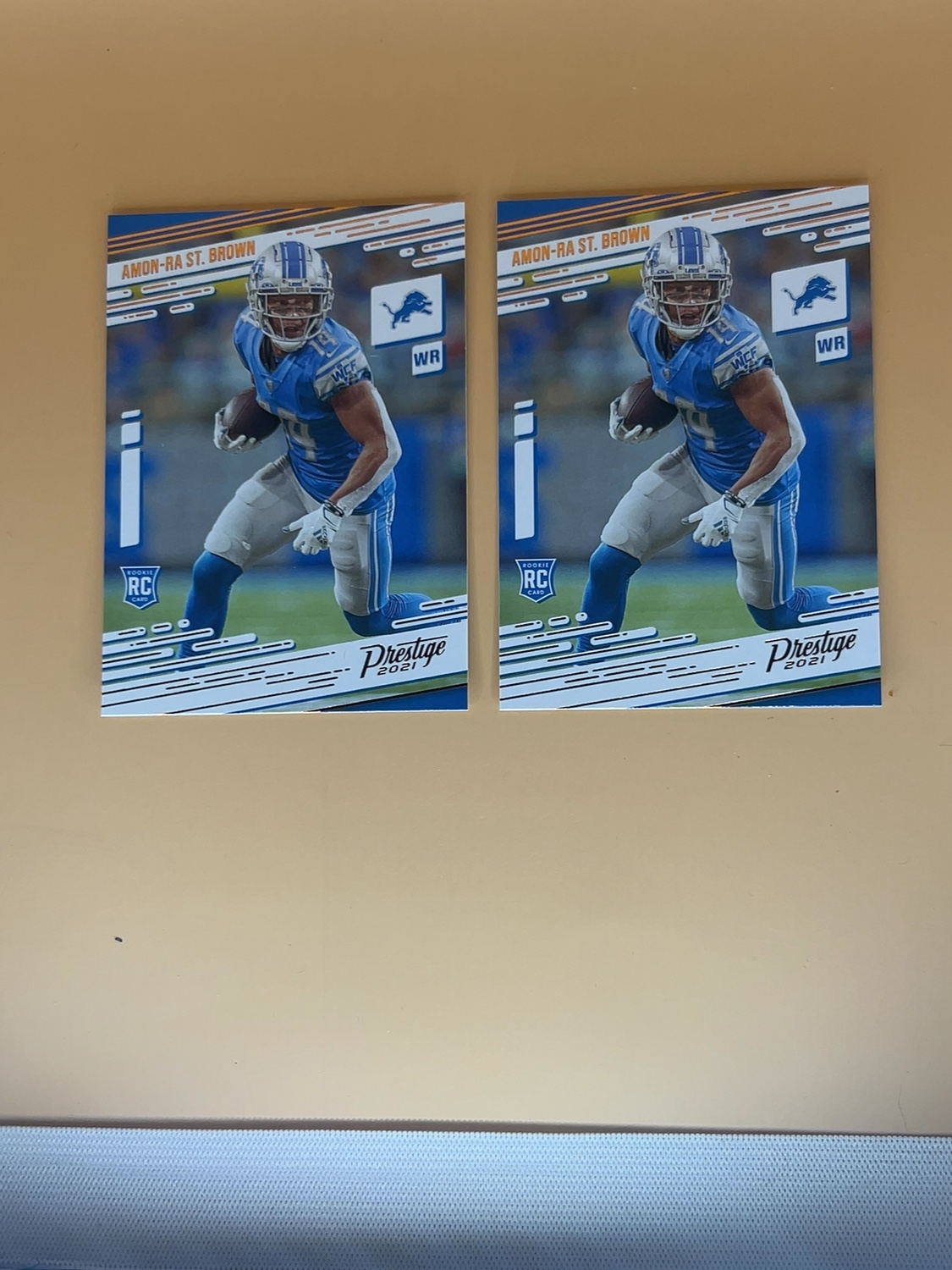 2021 Panini Chronicles Amon-Ra St Brown #234 Prestige Rookie 2 card lot