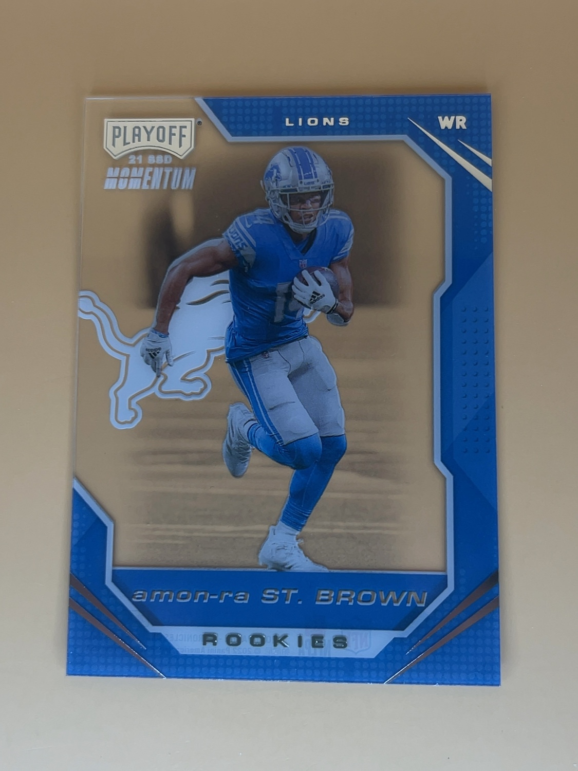Panini Chronicles  Amon-Ra St. Brown #PMR-28 Playoffs Momentum Rookie 